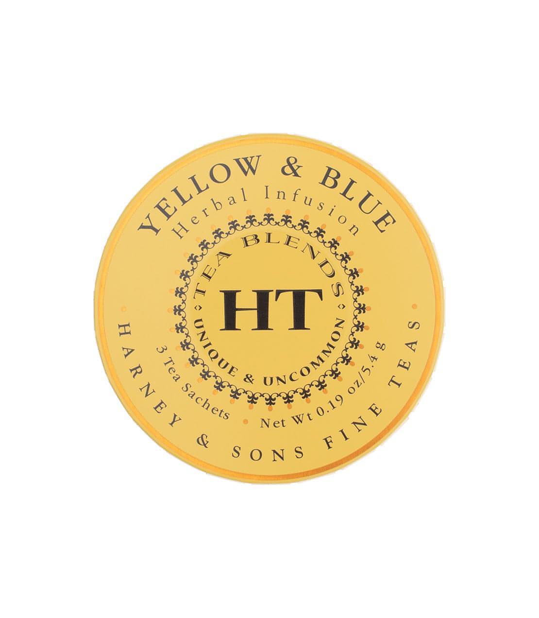 A yellow round tin of Harney and Sons tea Yellow & Blue herbal infusion blend and placed on a white background.