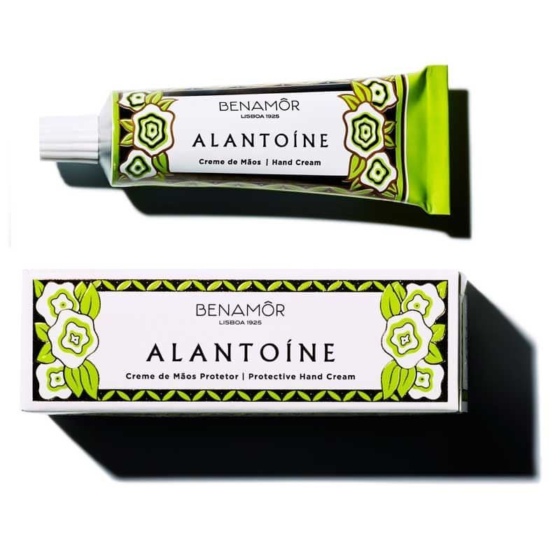 One tube of Benamor brand hand cream, and the the packaging with a green and white floral design. The product is called Alantoine, indicated for dry hands.