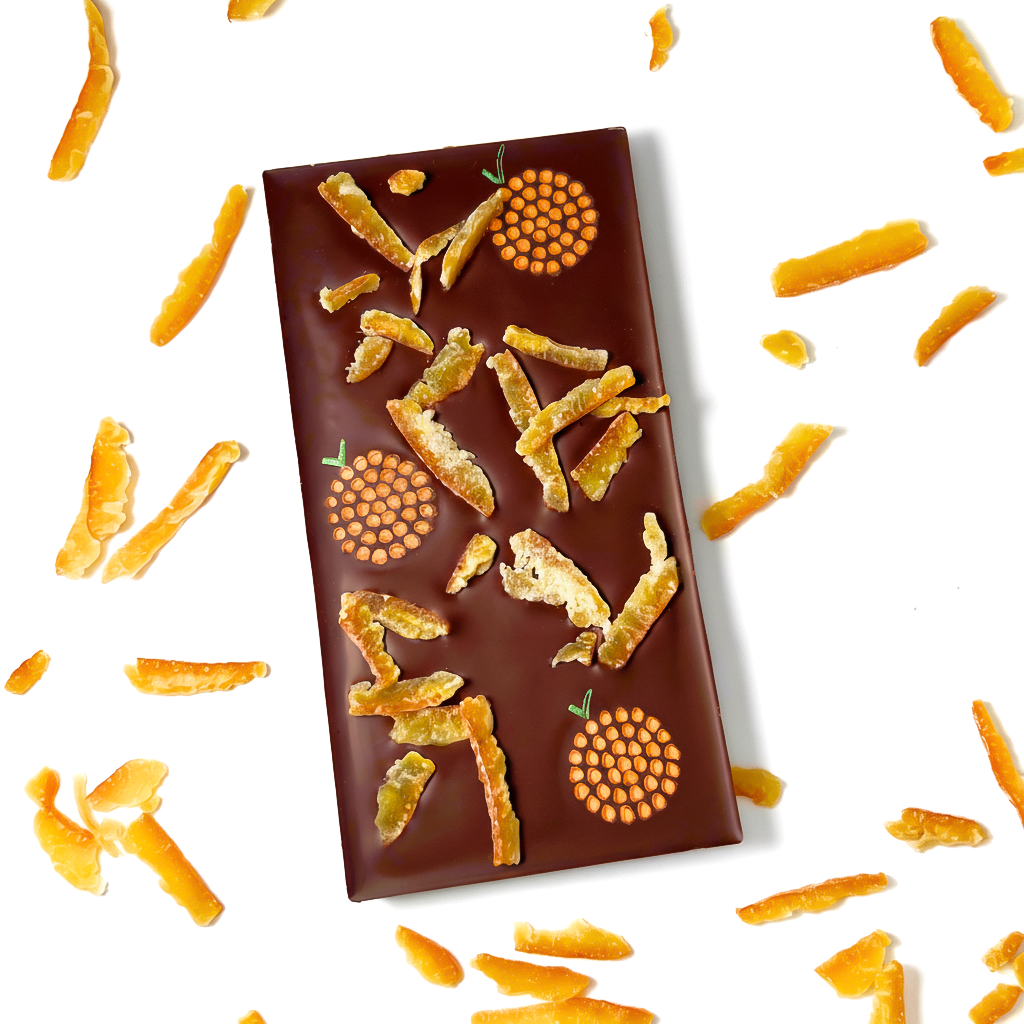 Chocolate bar with orange peel pieces on a white background