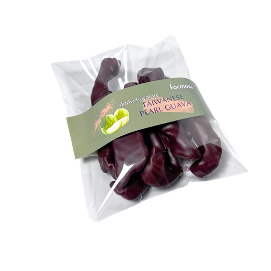Packaged dried Taiwanese pearl guava enrobed in dark chocolate by Formosa on a white background.