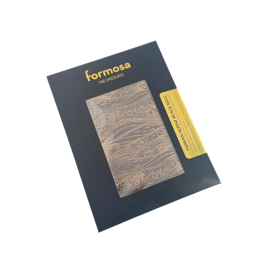 Image of  the Taiwan Alpine Black Milk Bar, a chocolate bar with a wood print texture design of a ocean, packaged in a black box with Formosa brand name visible, displayed on a white background.